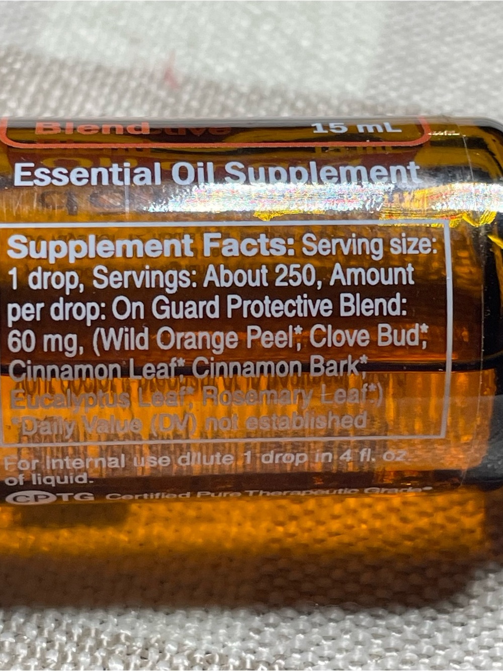 Doterra On Guard Essential Oil Bottle with Orange Label and Black Cap - Picture 2 of 5